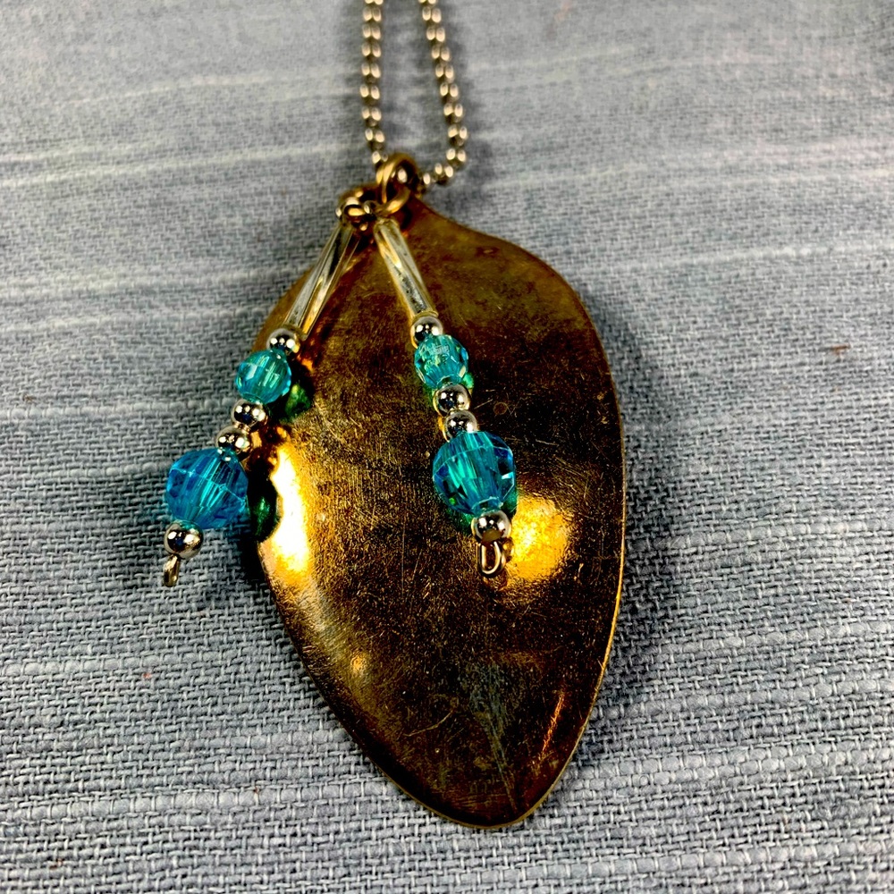 Fun found object with aqua and silver toned pendant necklace
